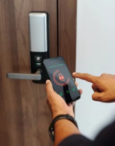 Person unlocking their home from their mobile phone